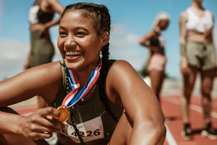 Woman winning a medal