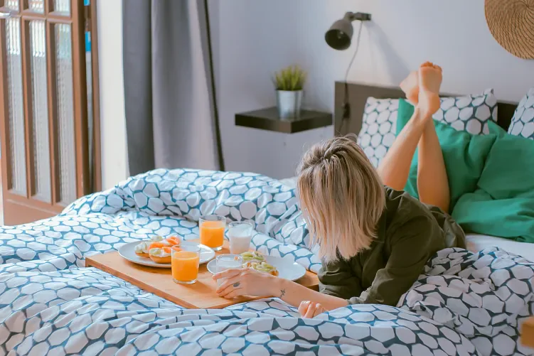 Woman resting in a bed